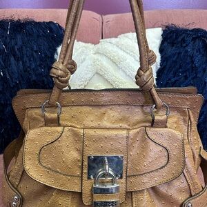 Brown embossed Guess Handbag